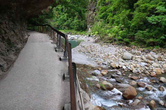 Taroko National Park in Taiwan. Shakadang hiking trail path cut out in rock cliff. Outdoors of Taiwan.