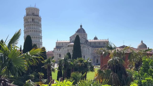Leaning Tower of Pisa and Cathedral Piazza dei Miracoli,  from the medieval city walls on a sunny day panoramic view.