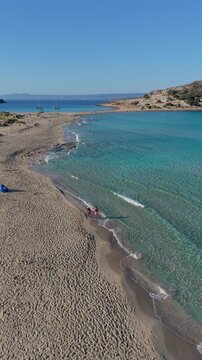 Simos Beach on Elafonisos Island features golden sands and crystal-clear waters. Relax in the sun or stroll along the shore while enjoying the natural beauty of Greeces stunning landscape.