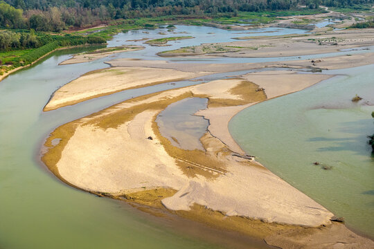 Aerial view of the Drina river with extensive sandbanks and shallow water channels winding through the landscape in Crna Bara, Macva District, Serbia.