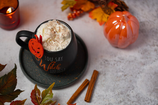 Overhead view of Halloween pumpkin spice latte with whipped cream