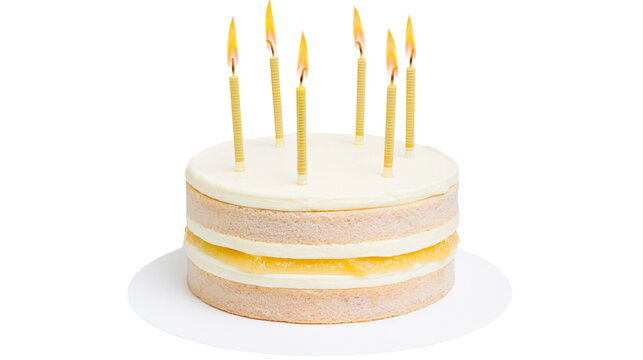 Layered vanilla cake with cream cheese frosting and fruit filling, lit candles