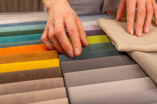 Upholstery fabric swatch selection for modern sofa design. Decorator smoothing light beige textile