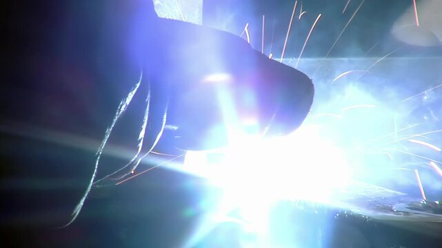 Inmate Welding Metal Creating Bright Sparks In Correctional Facility Workshop - 4K