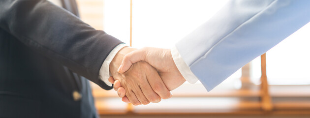 Successful deal asian young business woman, partnership, teamwork handshake or greeting together at office after project done, good deal. Happy business people, group meeting, colleagues shaking hands © KMPZZZ