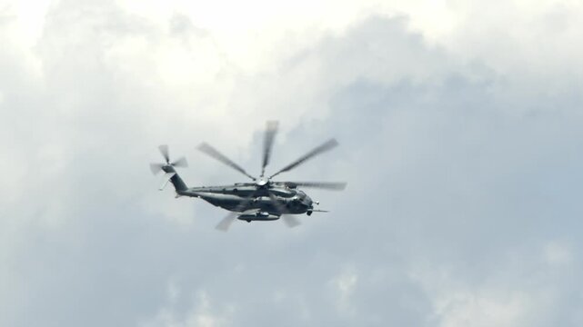 A CH-53E Super Stallion helicopter flies and banks over the Marine Corp Air Station in Beaufort, South Carolina