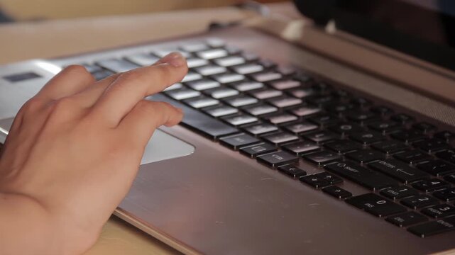 Close Up Of Person Using Laptop Touchpad And Typing On Keyboard - 4K