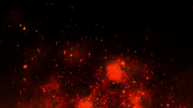 Glowing fire embers floating upward in dark atmospheric background video motion effect featuring hot sparks rising gracefully against deep black void creating intense visual energy for cinematic produ
