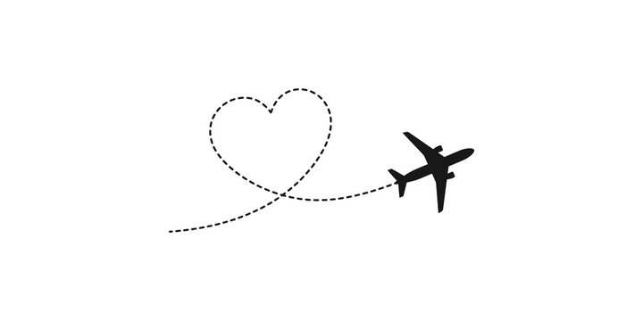 Airplane flying and drawing heart shape in sky.