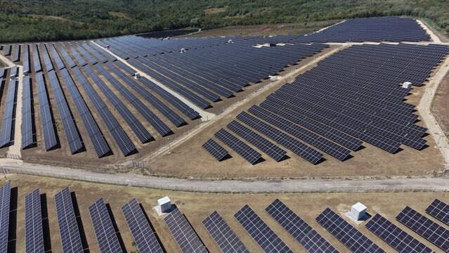 Aerial view of the 9.9 MW solar power plant featuring rows of photovoltaic panels installed on open land in Lapovo, Sumadija District, Serbia.