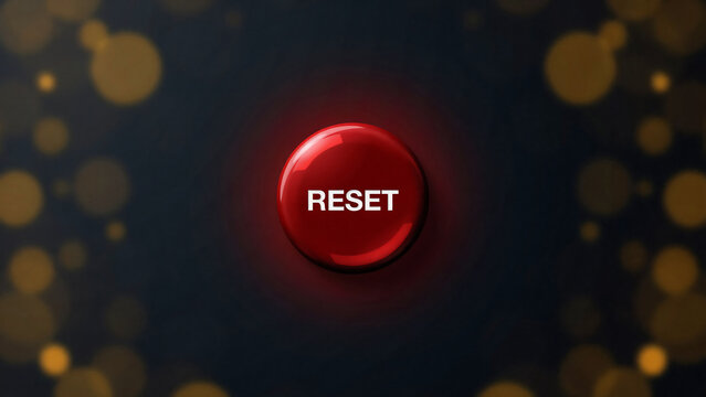 A bright red circular button with the word reset written on it