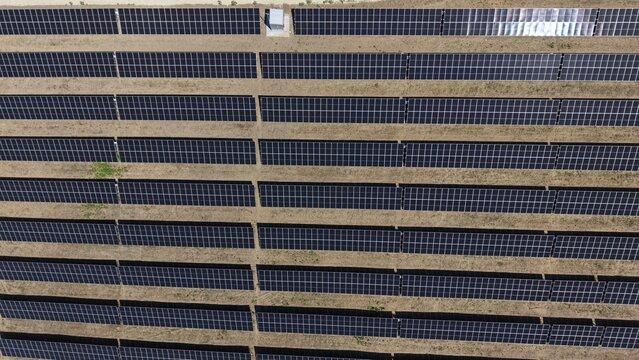 Aerial view of the 9,9 MW solar power plant featuring rows of photovoltaic panels installed on dry ground in Lapovo, Sumadija District, Serbia.