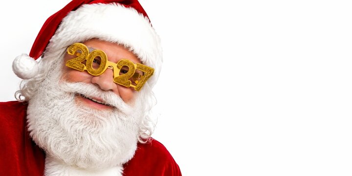Smiling Santa Claus wearing gold 2027 novelty glasses on white background with copy space for New Year celebration