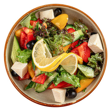 Greek salad with feta cheese and lemon isolated