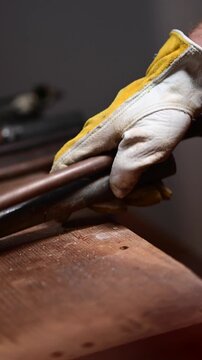 Selective focus video scrap metal, copper pipes, cutting stocking segregating, real people, b roll authentic video