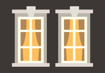 Fototapeta premium Dos ventanas iluminadas con cortinas sobre fondo oscuro