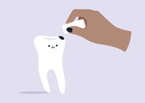 A hand holds an eraser, expertly erasing a cavity from a sad tooth, This whimsical scene helps children learn about dental care in a fun way, encouraging joyful habits.
