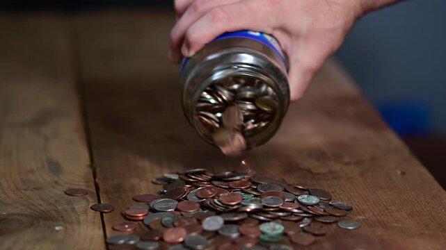 coin jar spilling the coins braking the bak savings economical depression resources theme, natural real people authentic video