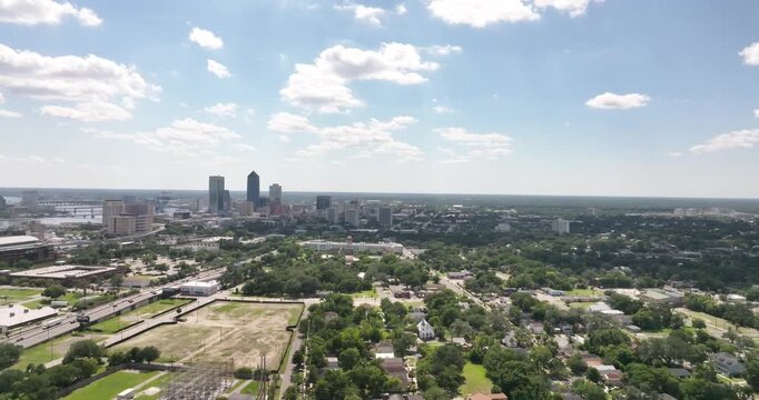 Aerial Drone View of Downtown Jacksonville, Florida Skyline Surrounded by Lush Green Trees&rdquo;