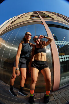 Friends enjoy outdoor workout session in the city during the day