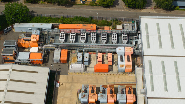 Aerial view of a data center featuring industrial external cooling units and HVAC systems for AI technology infrastructure in Hemel Hempstead, England, United Kingdom.