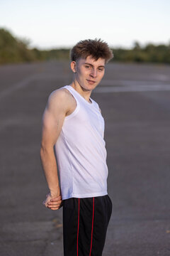 Teenage boy flexing his muscles
