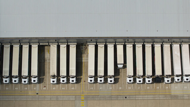 Aerial view of a distribution centre with rows of parked HGVs at loading bays in Hemel Hempstead, England, United Kingdom.