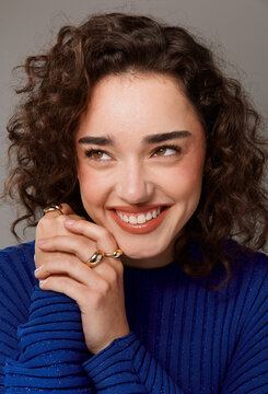 Smiling Person With Curly Hair Showing Hands 