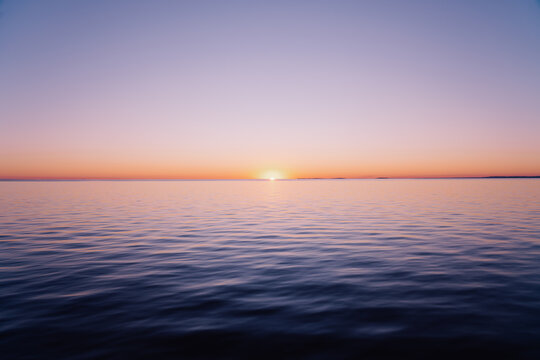 Distant Sun Meeting Ocean