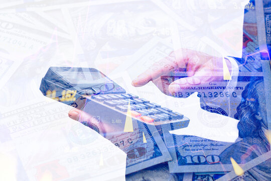 Businessman calculating on calculator with US dollar bills and stock market charts overlay. Financial accounting, currency trading, tax audit or investment planning concept for corporate banking.