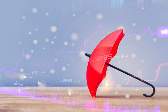 Financial risk protection concept with a red umbrella shielding against market uncertainty, investment volatility, economic risk, financial loss and changing business conditions.