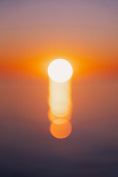Blurred Sun Over Horizon