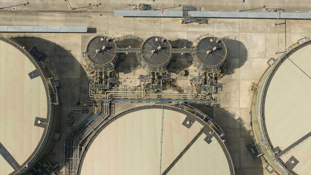 Aerial view of a petroleum oil and LPG terminal featuring large industrial storage tanks, complex piping systems, and concrete infrastructure in Hemel Hempstead, England, United Kingdom.