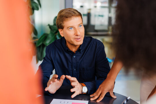 Man discussing business strategy during office meeting