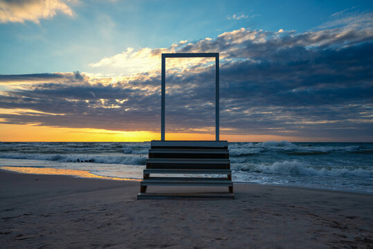 Open door and stairs access to the sea and sky. Concept image
