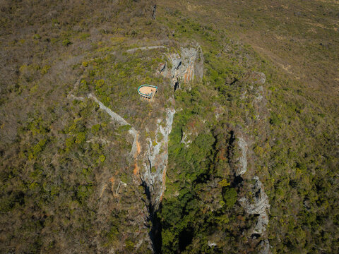 Aerial view of the French Mountain observation deck perched on a rugged cliffside surrounded by dense tropical vegetation in Antsiranana, Diana, Madagascar.