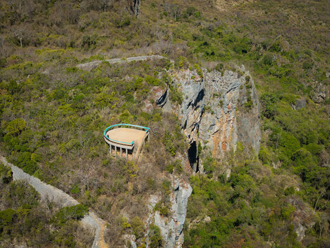 Aerial view of the lookout platform on French Mountain surrounded by lush tropical vegetation and dramatic rocky cliffs in Antsiranana, Diana, Madagascar.