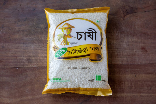 Kishoreganj, Bangladesh - 10 August, 2026 - Pack of Chashi Aromatic Chinigura Rice placed on wooden surface. Popular packaged rice product produced by Square Food.