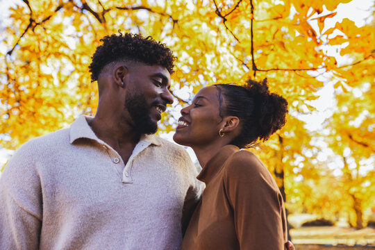 Intimate close up of a happy black couple in autumn