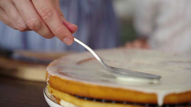 Close-up: pouring cream over golden pancake, tactile texture, 25 fps