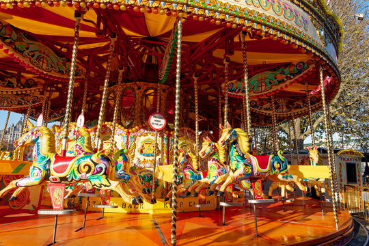 Beautifully decorated carousal horses on a merry-go-round