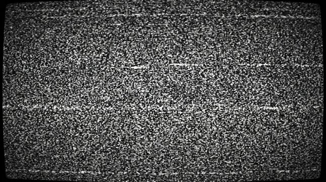 Grainy monochrome television screen displaying static noise interference captured on a vintage retro analog monitor display