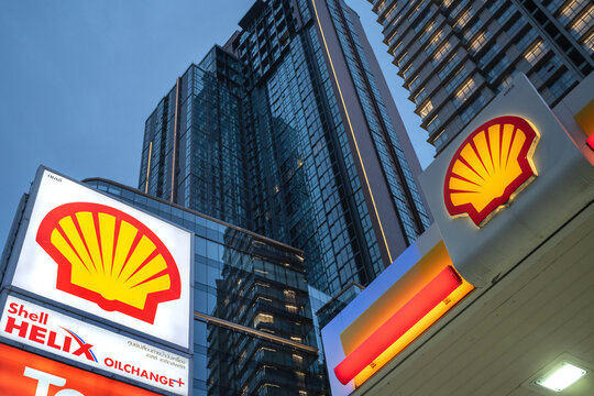 
Sign with brand logo for Shell plc, a British multinational oil and gas company, displayed outside a petrol service station in central Bangkok, Thailand. Asia.
