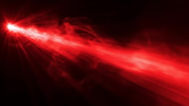 Red laser beam with smoke effect on black background, cinematic light ray and glowing energy flare, futuristic sci-fi optical overlay
