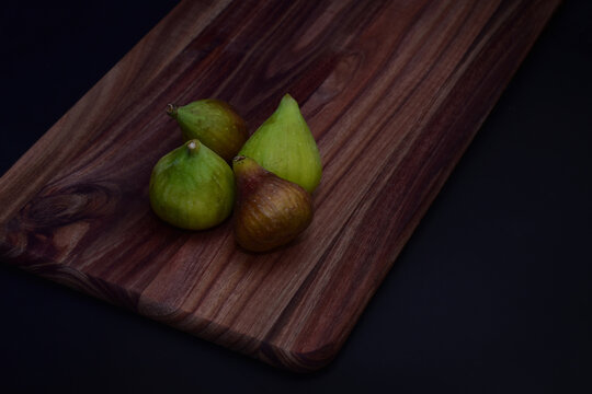 Figs on a wooden chopping board