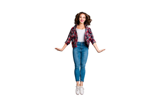 Full length size body view photo jumping high amazing attractive beautiful she her lady flight up in air pretty cute wearing casual jeans denim checkered plaid shirt grey background