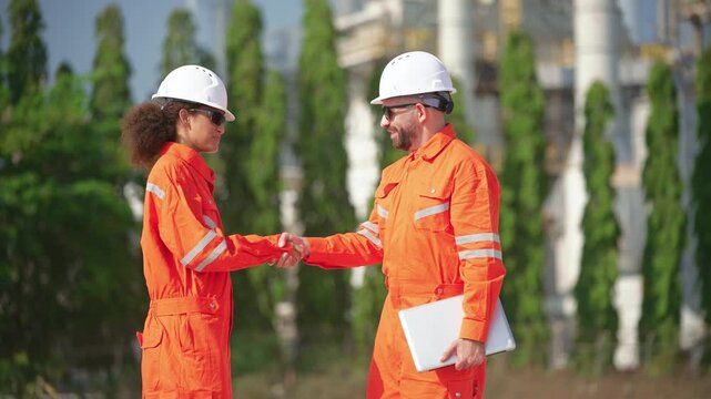 Industrial engineers inspecting an oil and gas refinery, reviewing plant operations and discussing maintenance, safety and energy infrastructure, refinery plant industry factory, Petrochemical plant.