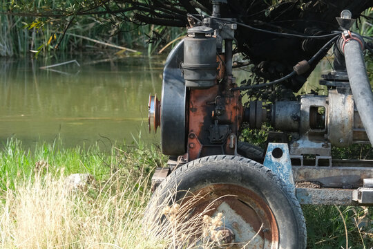Gasoline-powered water pump installed by the stream.