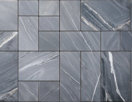 a gray marble floor with rectangular tiles and thin black grout lines