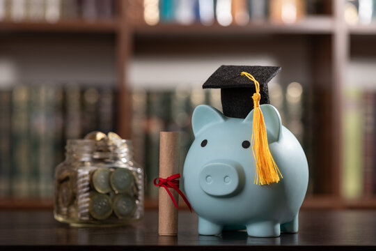 A conceptual image representing the cost of education, science funding, and financial literacy, featuring an academic cap and a piggy bank
